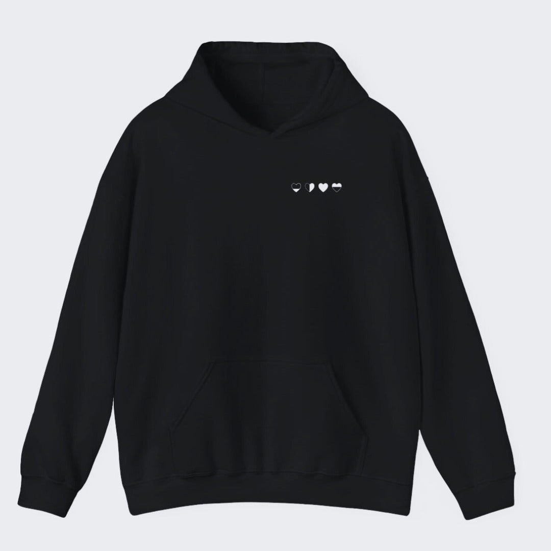 Healing Hearts hoodie in black with four hearts design on front — comfortable healing apparel