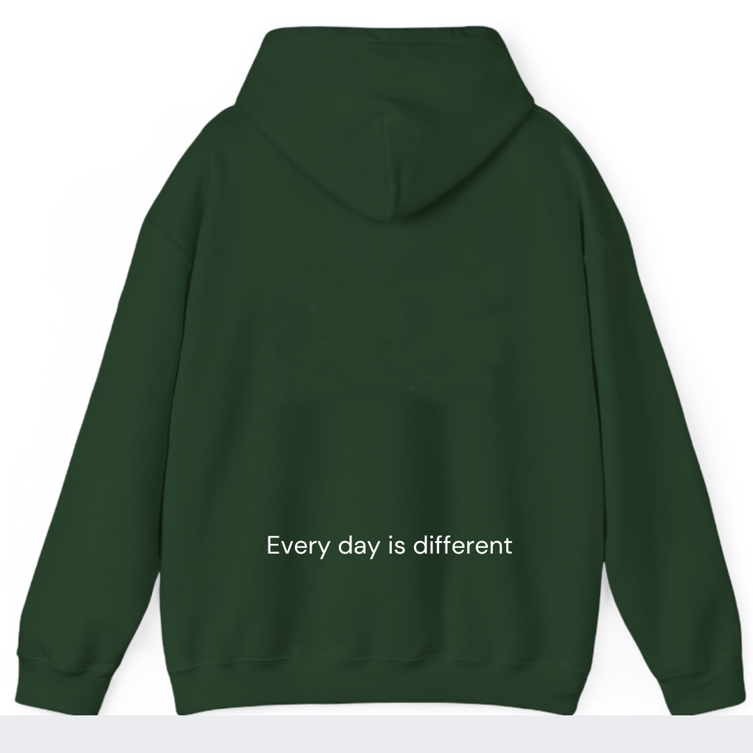 Back view of Healing Hearts green hoodie with embroidered ‘Every day is different’ mantra