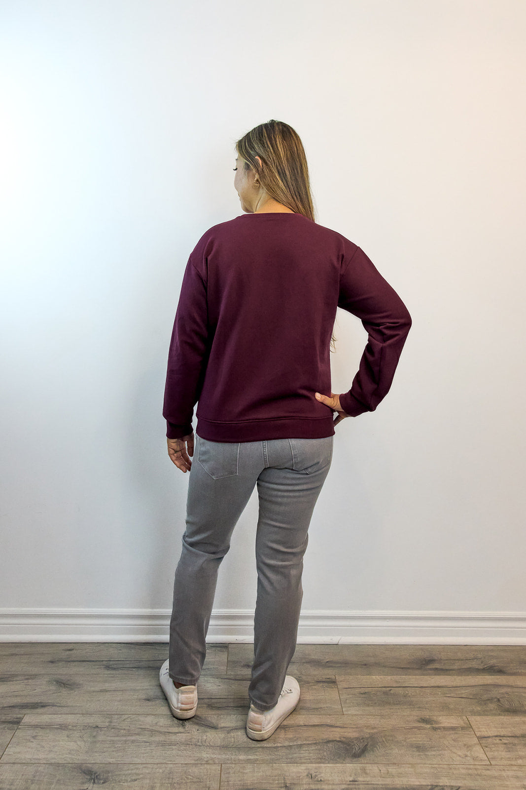 Back view of raspberry Heart Sweater featuring embroidered design — sustainable comfort clothing for everyday calm and healing.