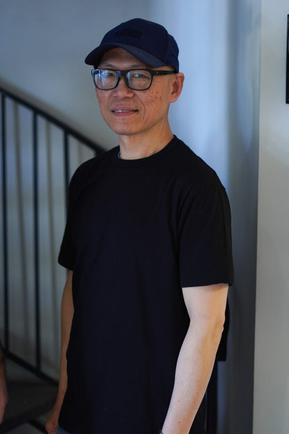 Man wearing black Men’s Healing T-shirt – comfortable and meaningful emotional growth apparel